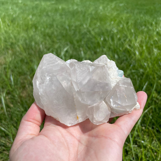 Aquamarine with muscovite on cluster of perfectly terminated smokey quartz points