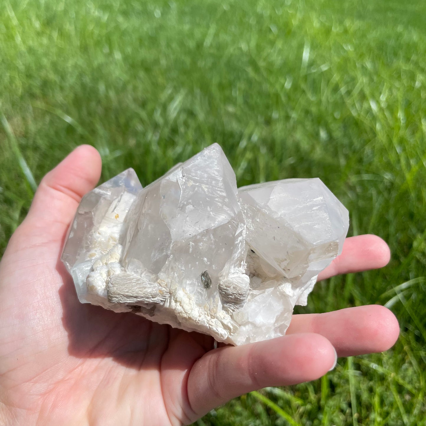 Aquamarine with muscovite on cluster of perfectly terminated smokey quartz points