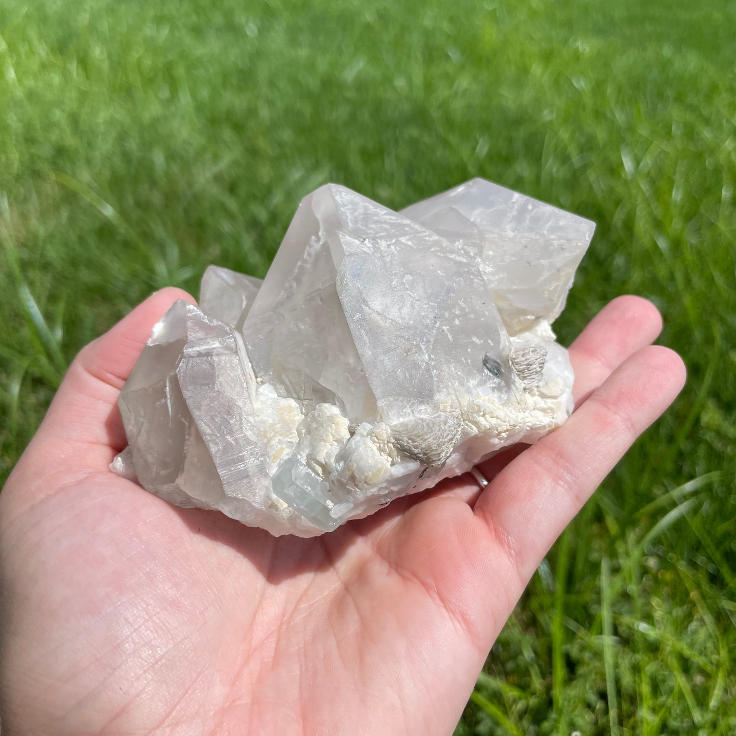 Aquamarine with muscovite on cluster of perfectly terminated smokey quartz points